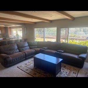 Brown leather sectional couch.